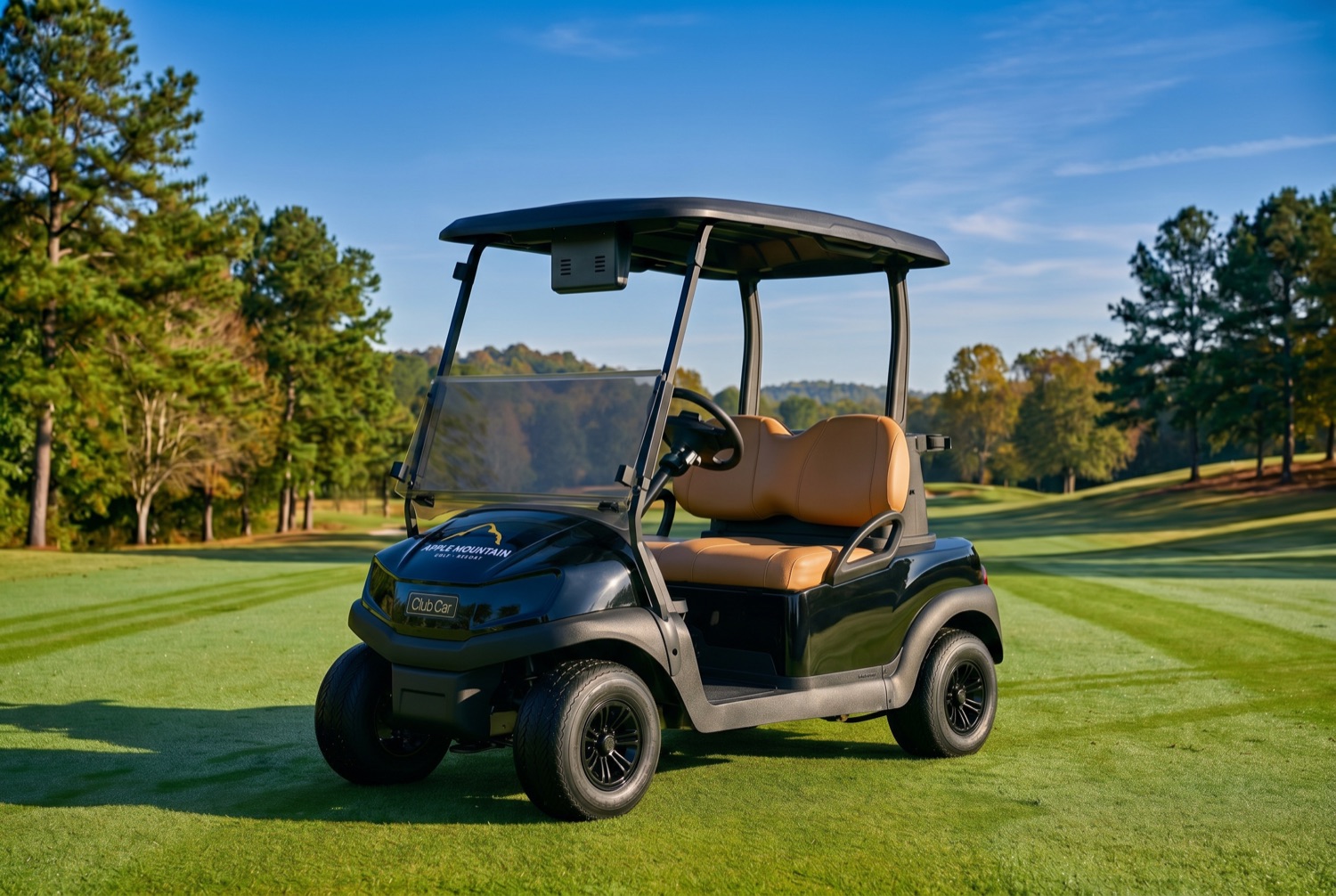 Concept rendering of new Apple Mountain golf carts with black body, tan seats, and gold logo